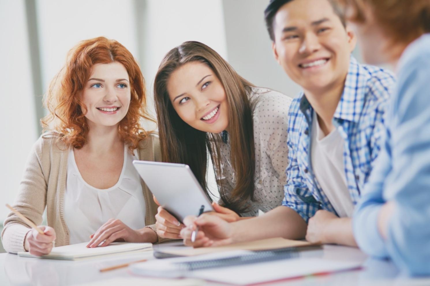 Business professionals analyzing financial reports and market trends